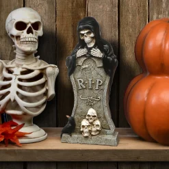 12 in. Halloween Skeleton Behind a Tombstone Decoration