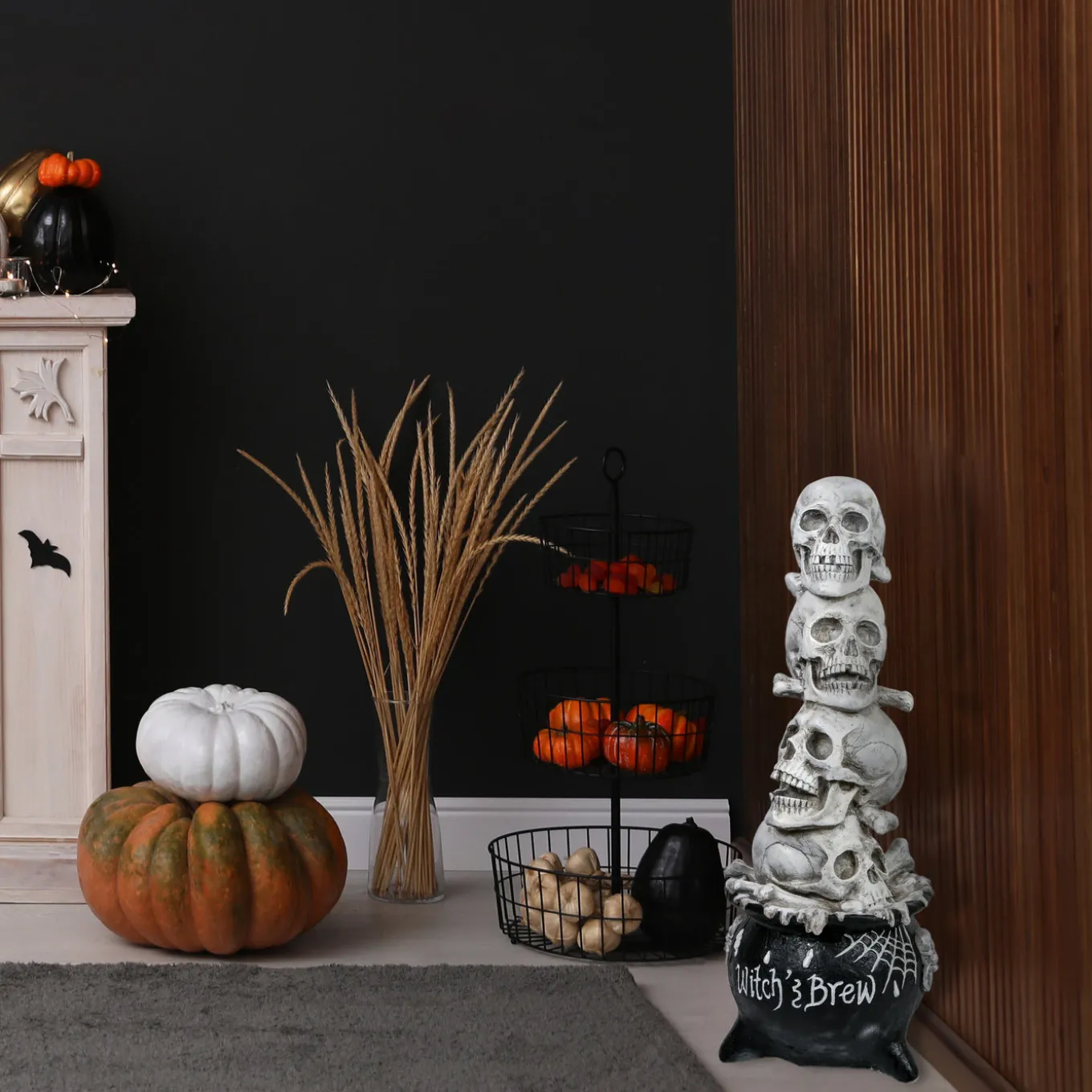 38 in. Halloween Stacked Skulls in a Cauldron Tabletop Decoration